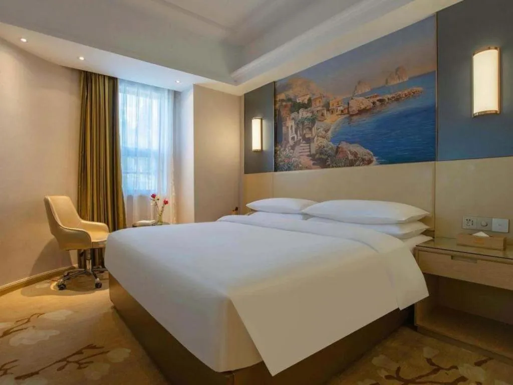 Bed in Vienna Hotel Yunnan Lijiang Ancient City