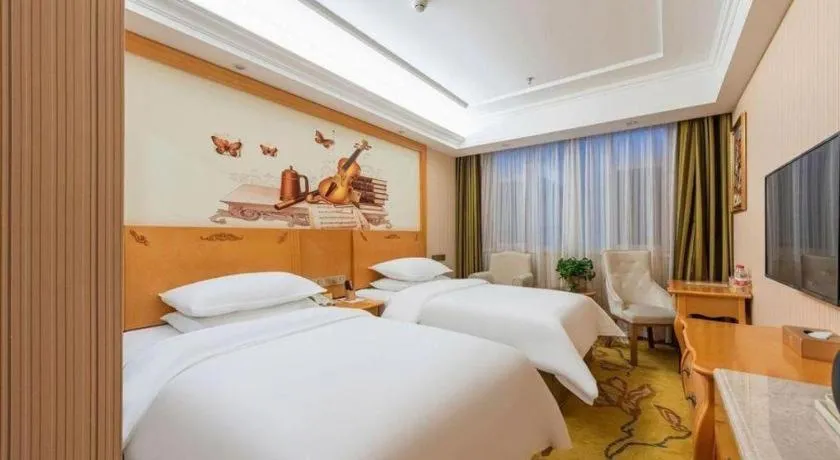 Bed in Vienna Hotel Hebei Cangzhou Mingzhu Market