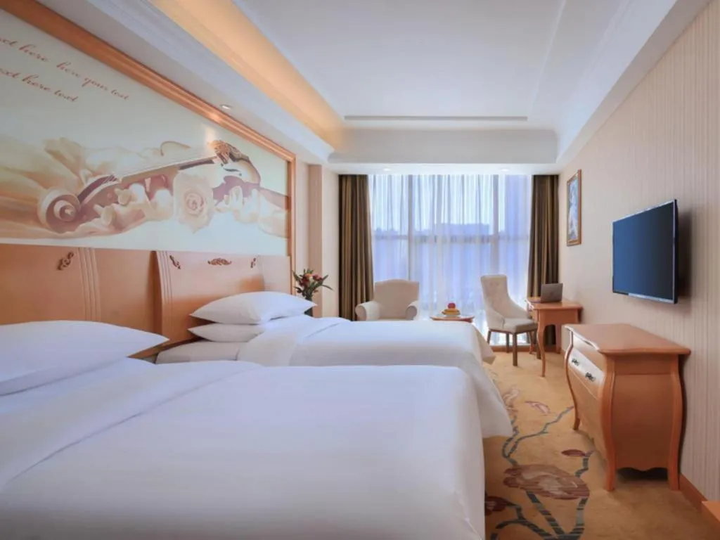 Bed in Vienna Hotel Hebei Cangzhou Mingzhu Market