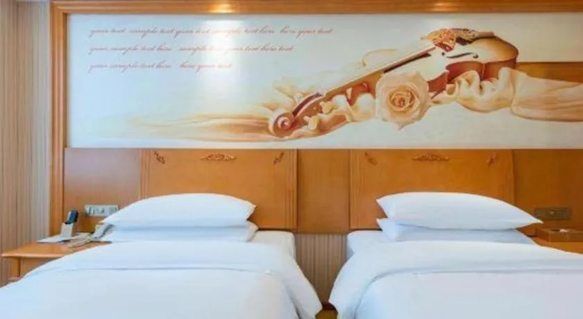 Bed in Vienna Hotel Hebei Cangzhou Mingzhu Market