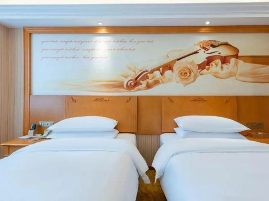 Bed in Vienna Hotel Hebei Cangzhou Mingzhu Market