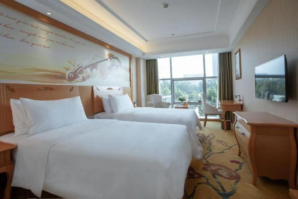 Bed in Vienna Hotel Hebei Cangzhou Mingzhu Market