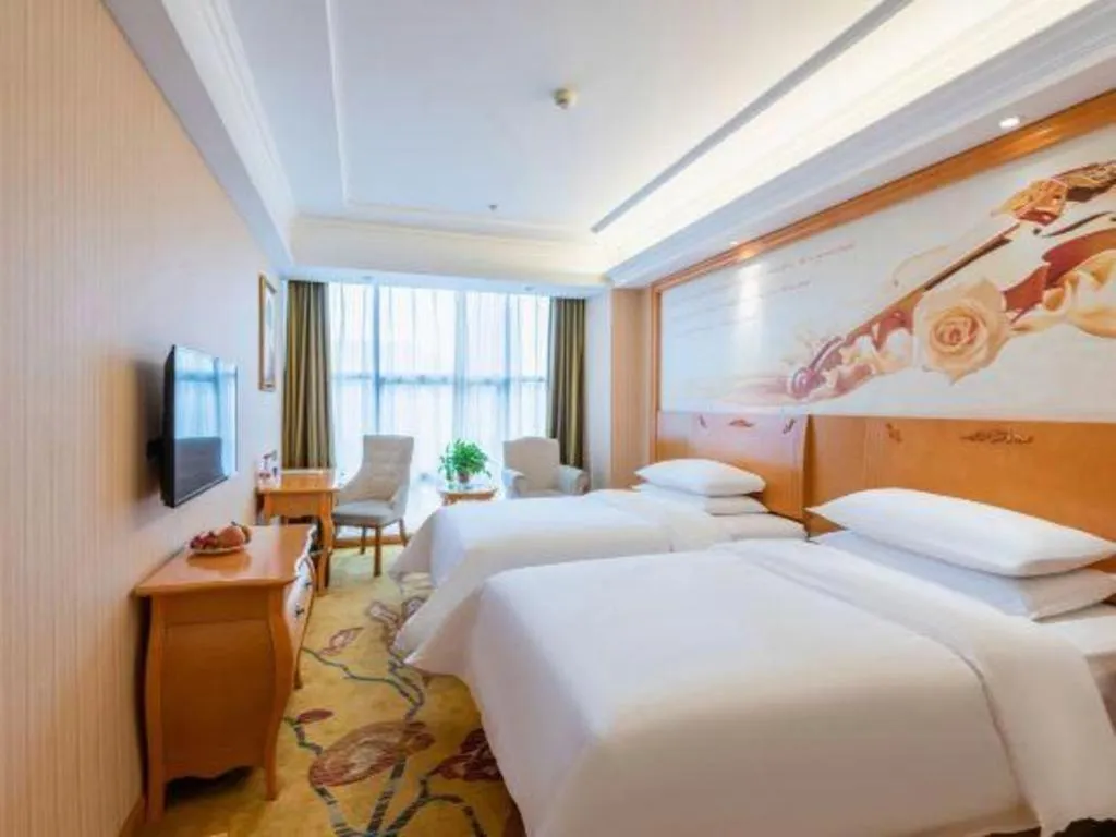 Bed in Vienna Hotel Hebei Cangzhou Mingzhu Market