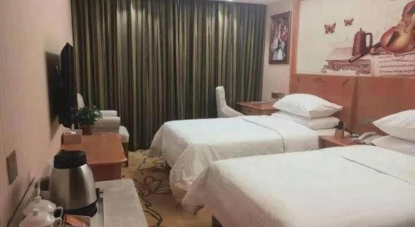 Bed in Vienna Hotel Hebei Cangzhou Mingzhu Market