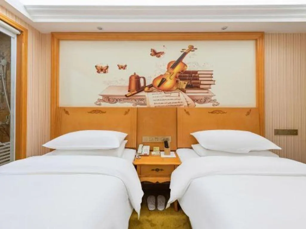 Bed in Vienna Hotel Hebei Cangzhou Mingzhu Market