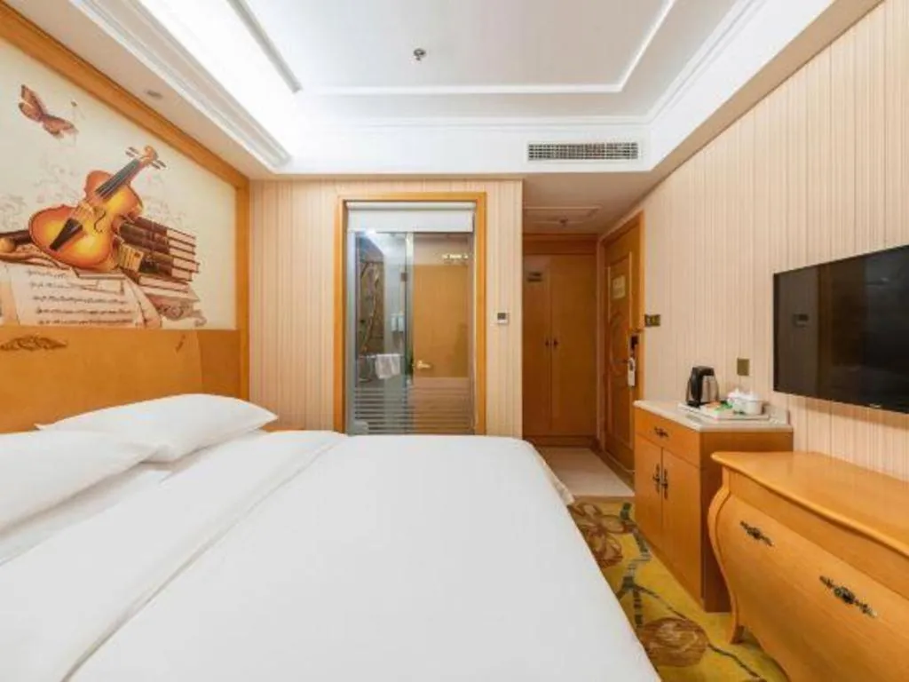 Bed in Vienna Hotel Hebei Cangzhou Mingzhu Market