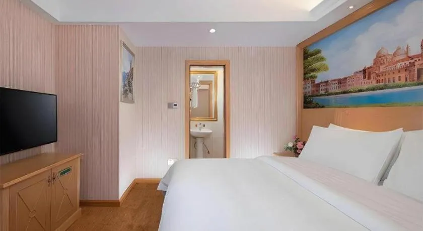 Bed in Vienna Hotel Hunan Jishou Fenghuang Ancient City