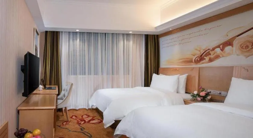 Bed in Vienna Hotel Hunan Jishou Fenghuang Ancient City