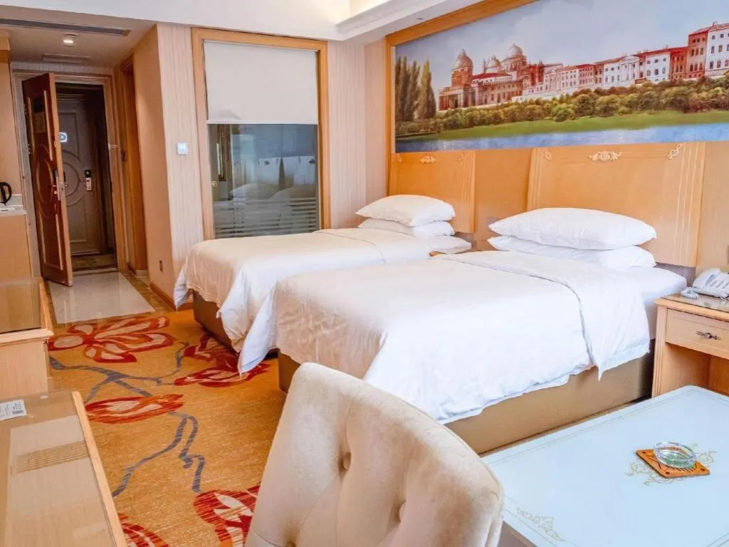 Bed in Vienna Hotel Hunan Jishou Fenghuang Ancient City