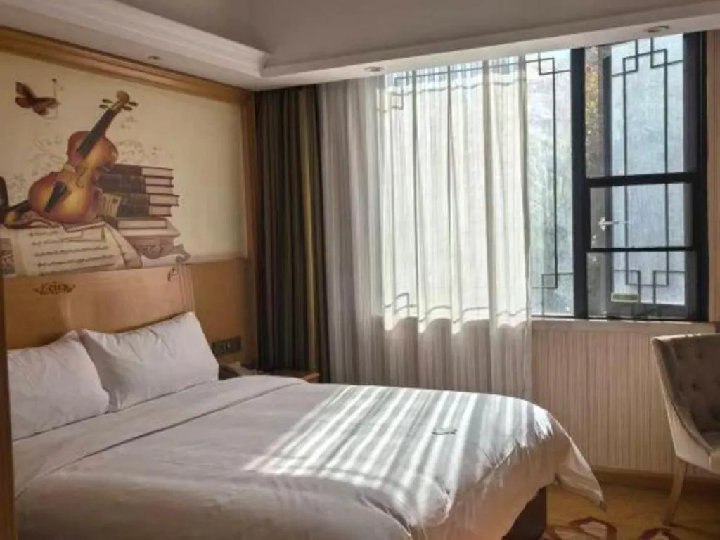 Bed in Vienna Hotel Hunan Jishou Fenghuang Ancient City