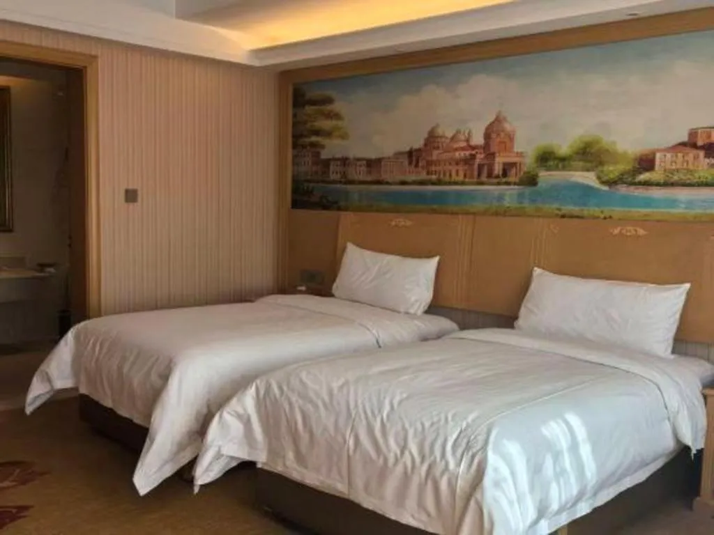 Bed in Vienna Hotel Hunan Jishou Fenghuang Ancient City