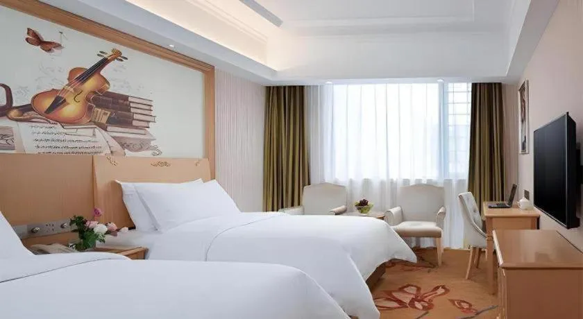 Bed in Vienna Hotel Hunan Jishou Fenghuang Ancient City