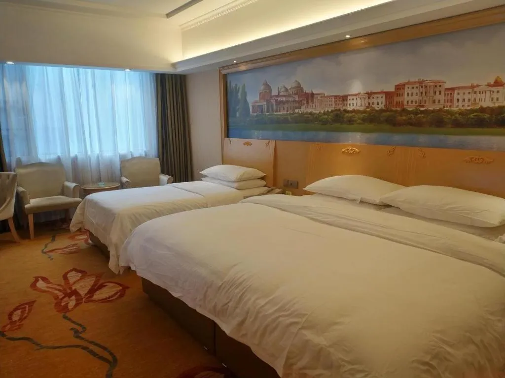 Bed in Vienna Hotel Hunan Jishou Fenghuang Ancient City