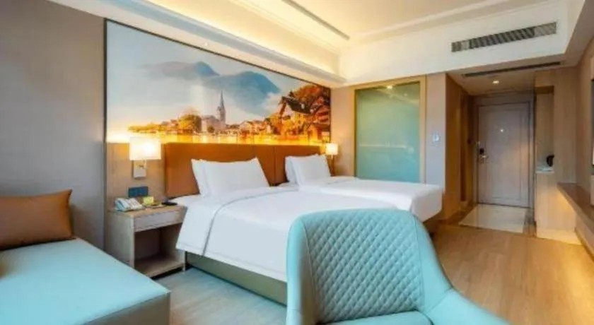 Bed in Vienna Hotel Hunan Jishou Fenghuang Ancient City