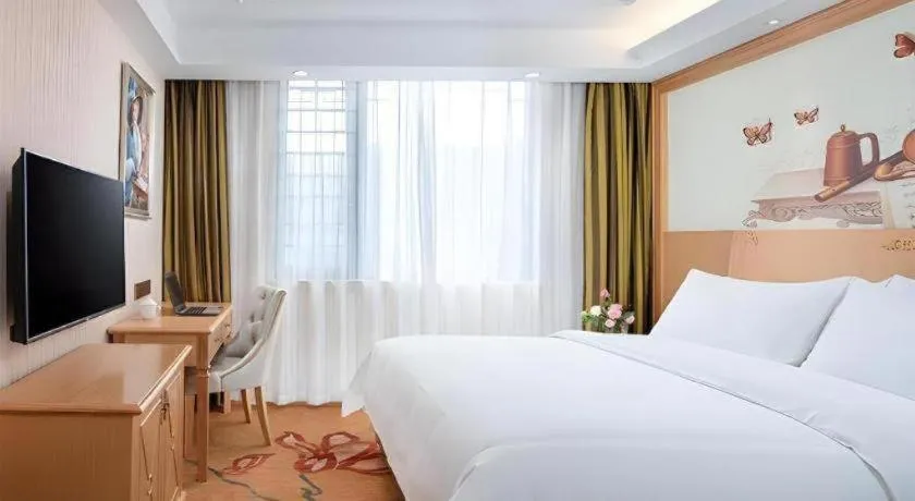 Bed in Vienna Hotel Hunan Jishou Fenghuang Ancient City