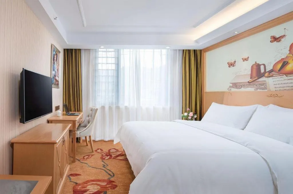 Bed in Vienna Hotel Hunan Jishou Fenghuang Ancient City