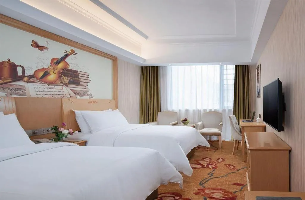 Bed in Vienna Hotel Hunan Jishou Fenghuang Ancient City