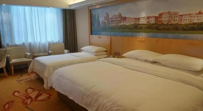Bed in Vienna Hotel Hunan Jishou Fenghuang Ancient City