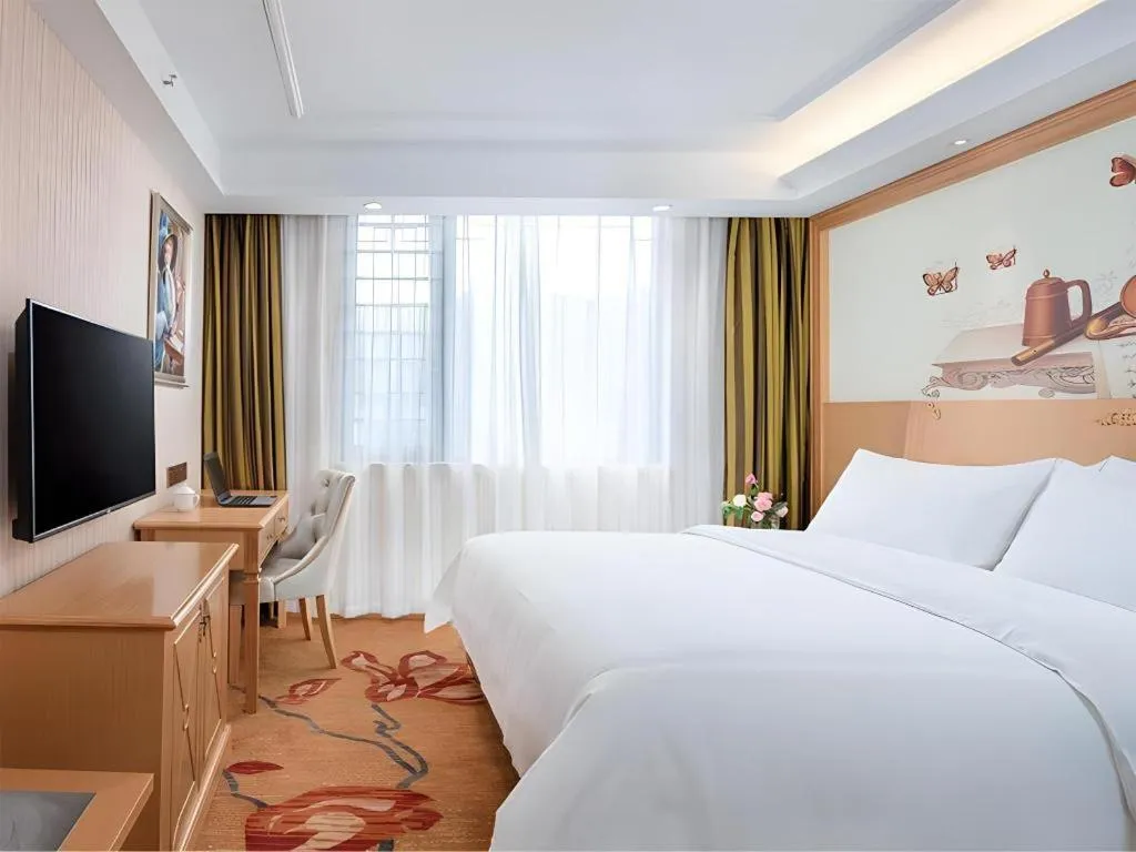 Bed in Vienna Hotel Hunan Jishou Fenghuang Ancient City