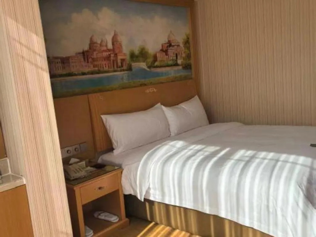 Bed in Vienna Hotel Hunan Jishou Fenghuang Ancient City