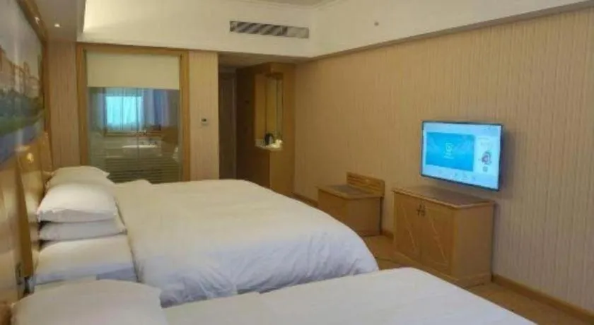 Bed in Vienna Hotel Hunan Jishou Fenghuang Ancient City