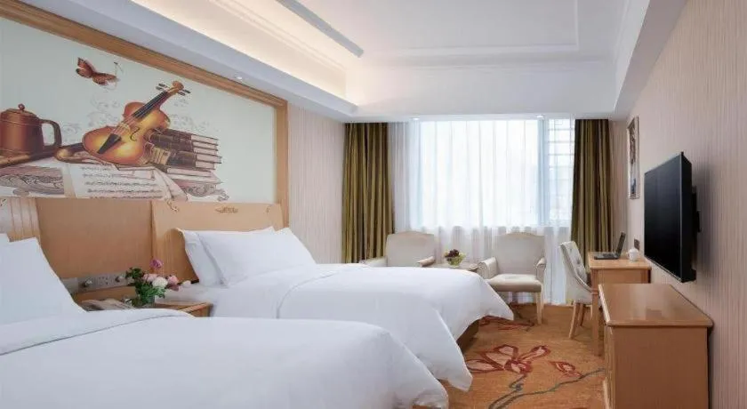 Bed in Vienna Hotel Hunan Jishou Fenghuang Ancient City