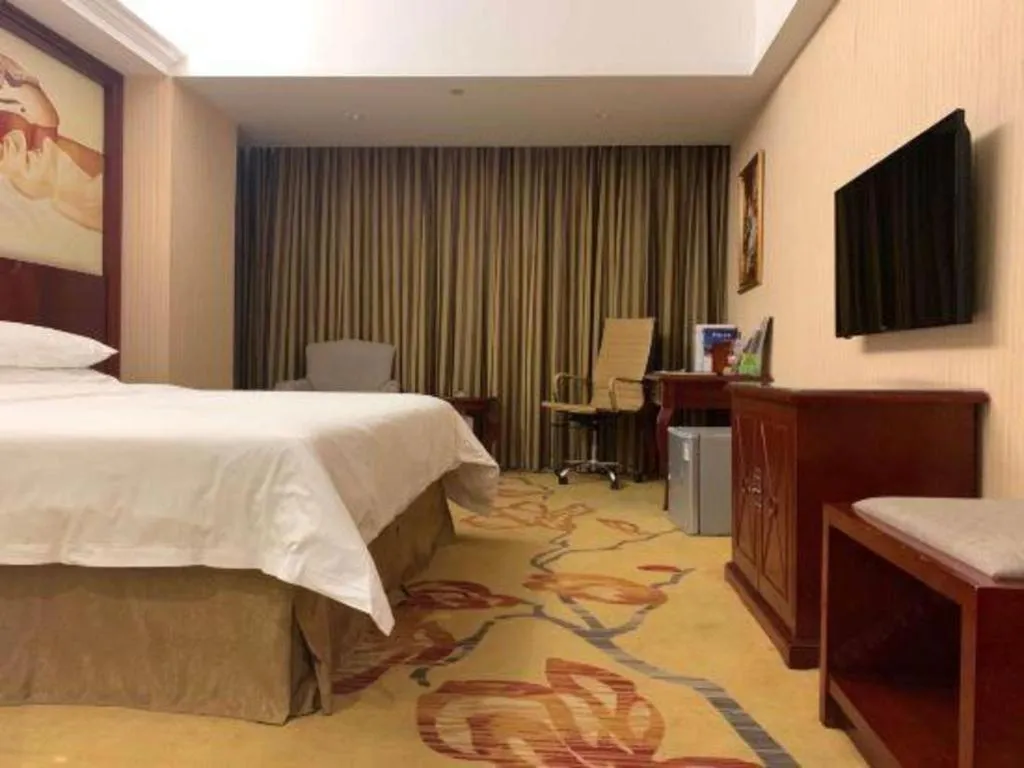 Bed in Vienna Hotel Guangdong Zhongshan Ancient Town Lighting Expo Center