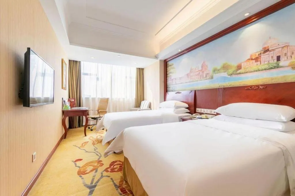 Bed in Vienna Hotel Guangdong Zhongshan Ancient Town Lighting Expo Center