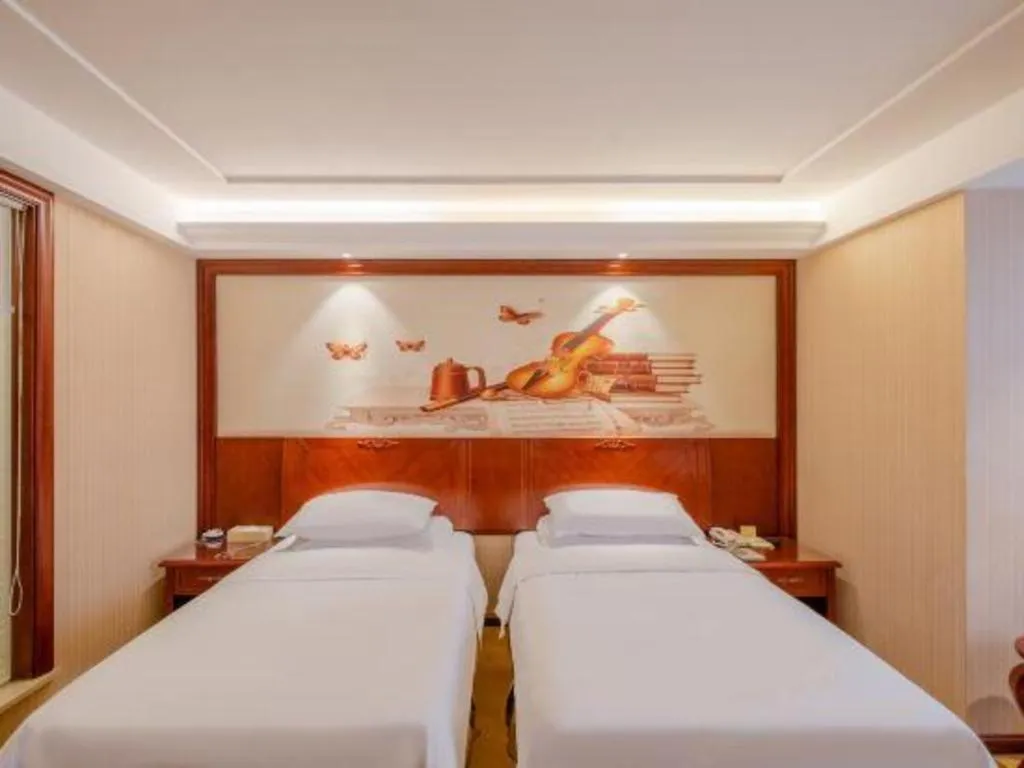 Bed in Vienna Hotel Guangdong Zhongshan Ancient Town Lighting Expo Center
