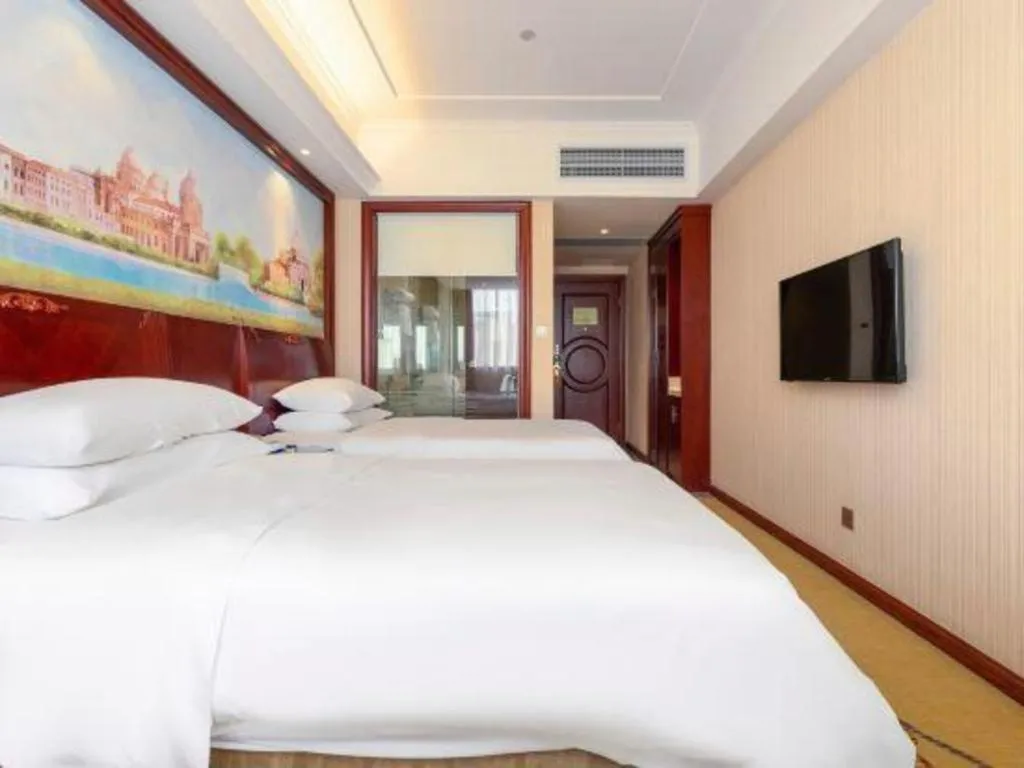 Bed in Vienna Hotel Guangdong Zhongshan Ancient Town Lighting Expo Center