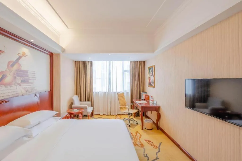 Bed in Vienna Hotel Guangdong Zhongshan Ancient Town Lighting Expo Center