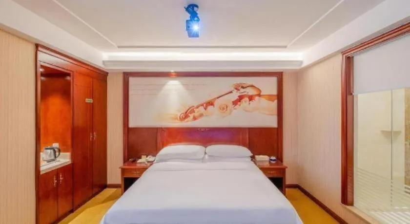 Bed in Vienna Hotel Guangdong Zhongshan Ancient Town Lighting Expo Center