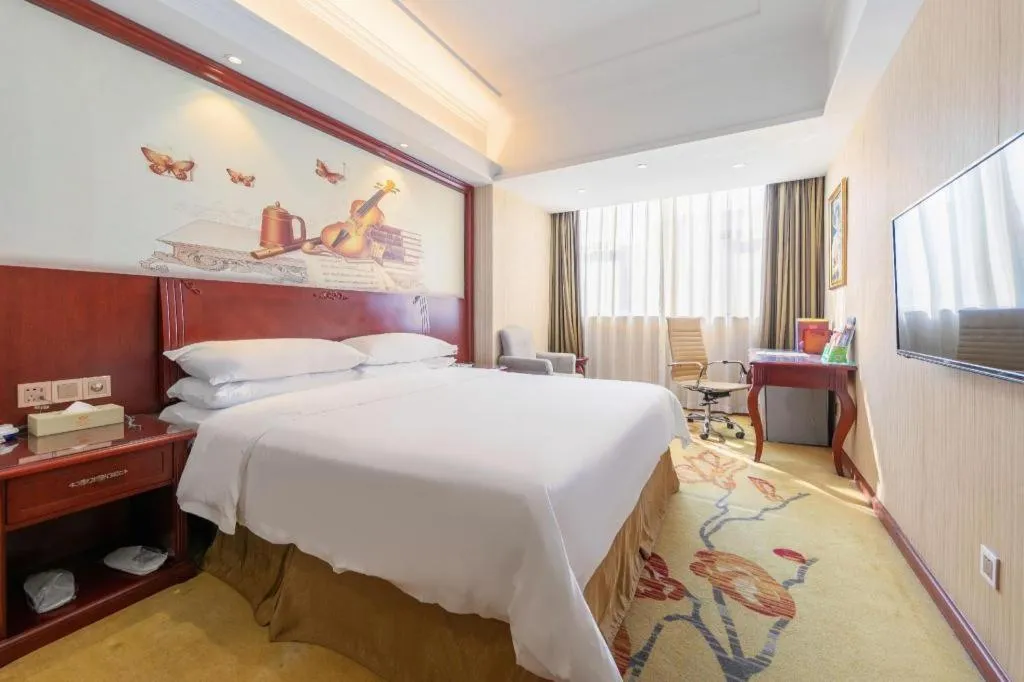 Bed in Vienna Hotel Guangdong Zhongshan Ancient Town Lighting Expo Center