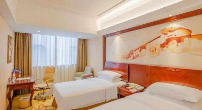 Bed in Vienna Hotel Guangdong Zhongshan Ancient Town Lighting Expo Center