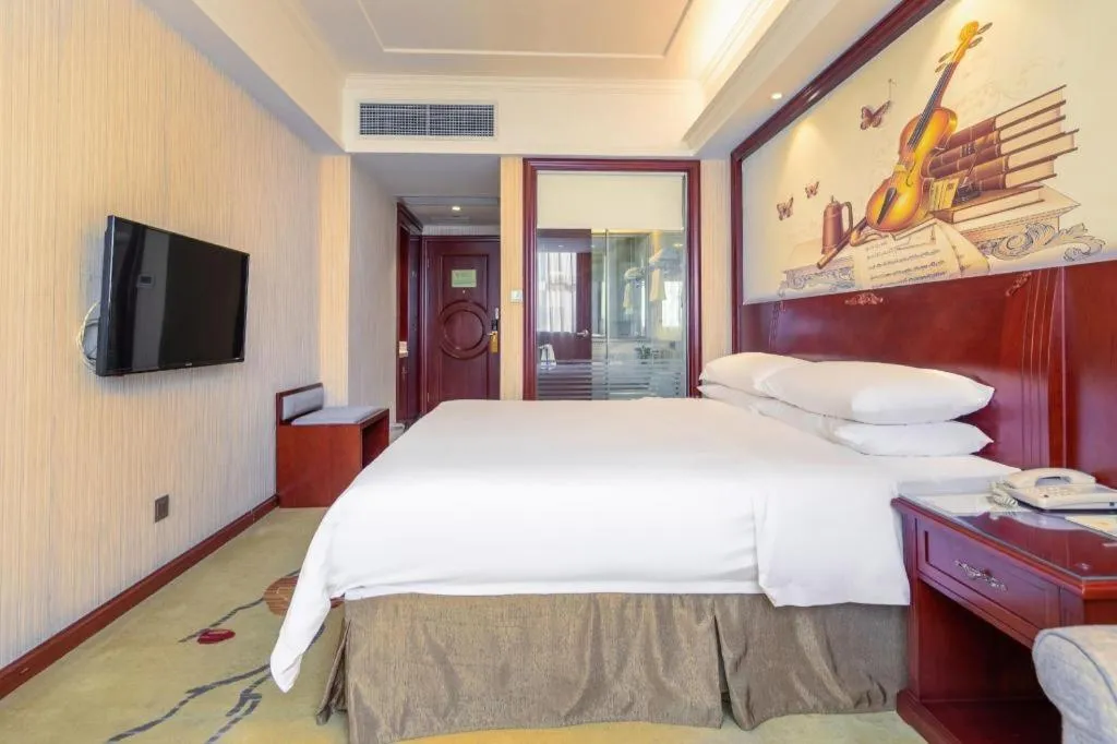 Bed in Vienna Hotel Guangdong Zhongshan Ancient Town Lighting Expo Center