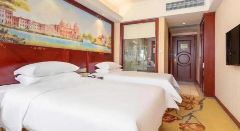 Bed in Vienna Hotel Guangdong Zhongshan Ancient Town Lighting Expo Center