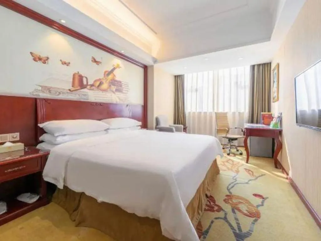 Bed in Vienna Hotel Guangdong Zhongshan Ancient Town Lighting Expo Center