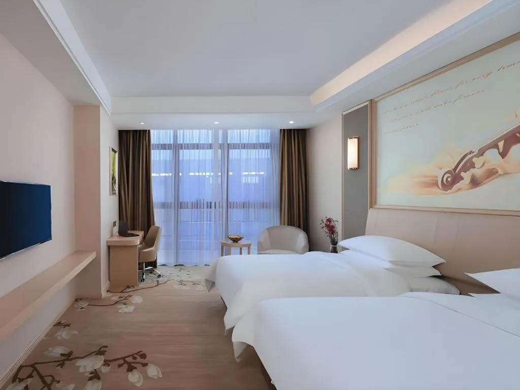 Bed in Vienna Hotel Fujian Fuqing Wanda Plaza