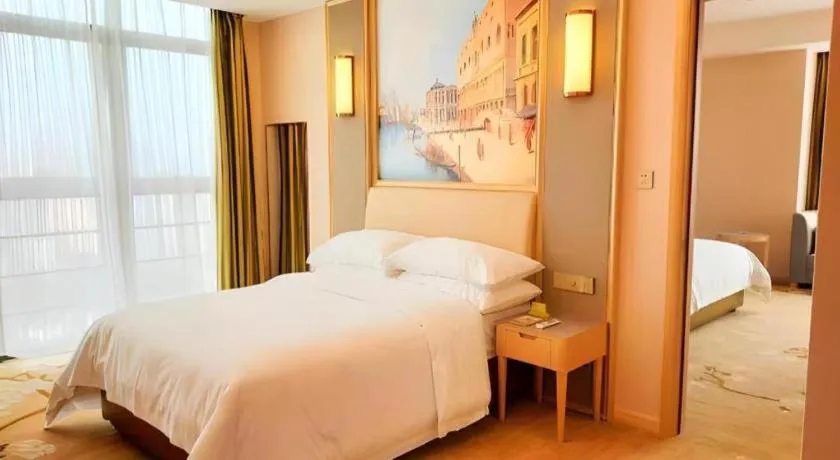 Bed in Vienna Hotel Fujian Fuqing Wanda Plaza
