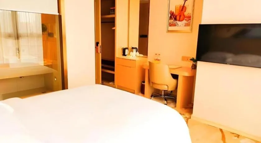 Bed in Vienna Hotel Fujian Fuqing Wanda Plaza