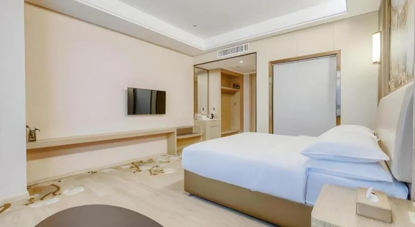 Bed in Vienna Hotel Fujian Fuqing Wanda Plaza