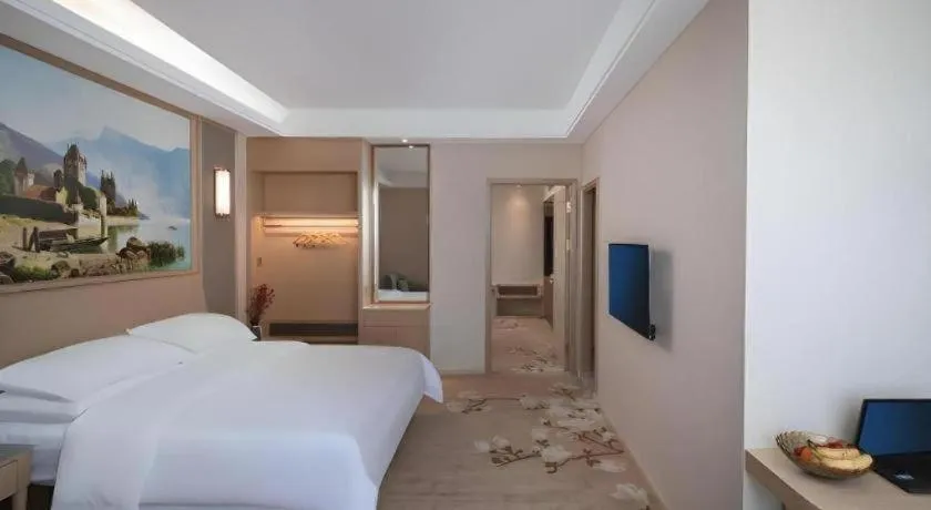 Bed in Vienna Hotel Fujian Fuqing Wanda Plaza