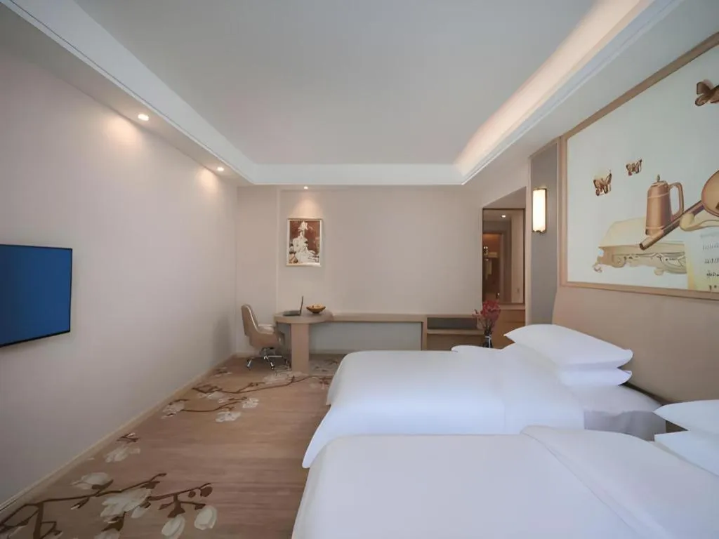 Bed in Vienna Hotel Fujian Fuqing Wanda Plaza