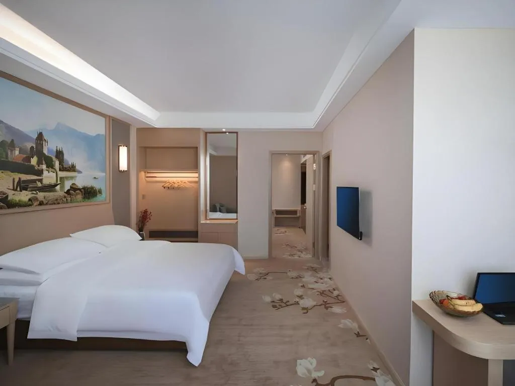 Bed in Vienna Hotel Fujian Fuqing Wanda Plaza