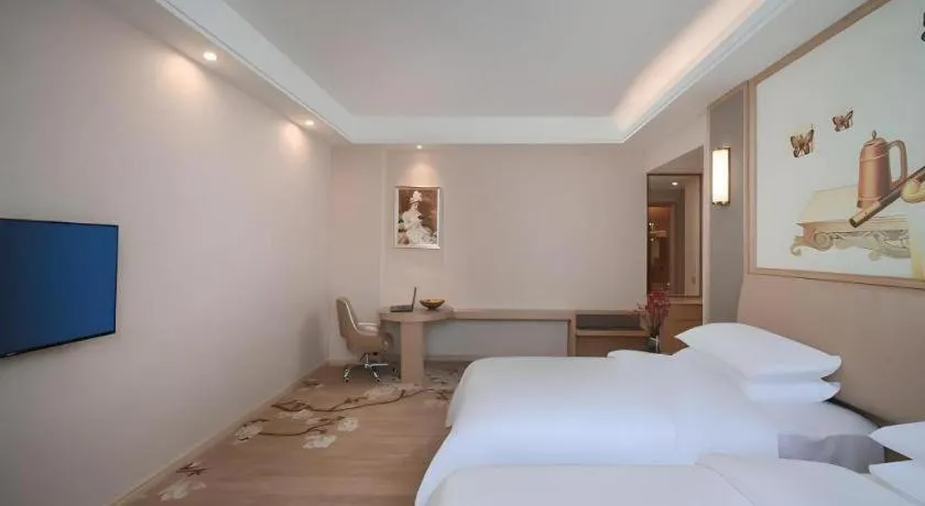 Bed in Vienna Hotel Fujian Fuqing Wanda Plaza