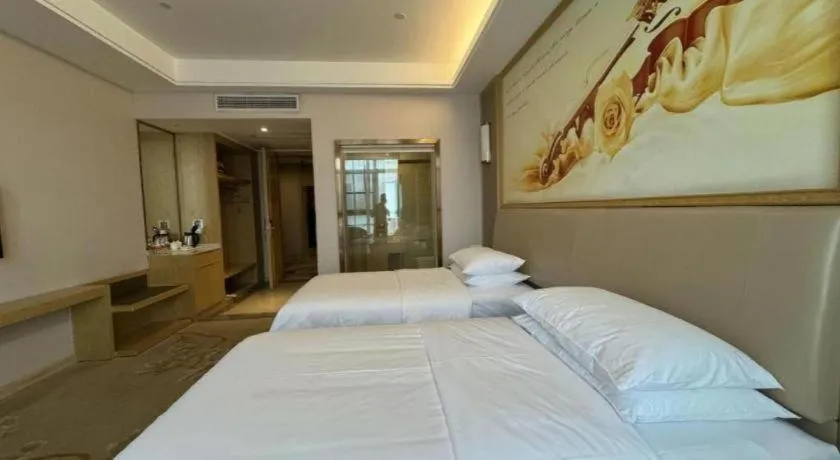 Bed in Vienna Hotel Fujian Fuqing Wanda Plaza