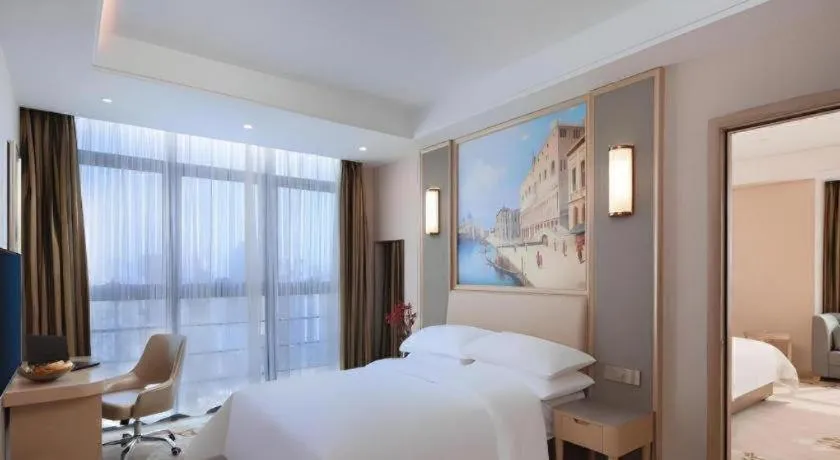 Bed in Vienna Hotel Fujian Fuqing Wanda Plaza