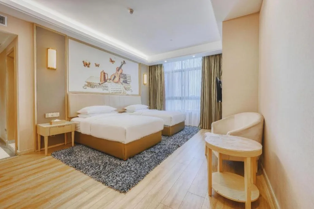 Bed in Vienna Hotel Fujian Fuqing Wanda Plaza