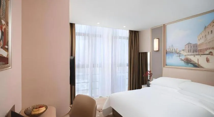 Bed in Vienna Hotel Fujian Fuqing Wanda Plaza