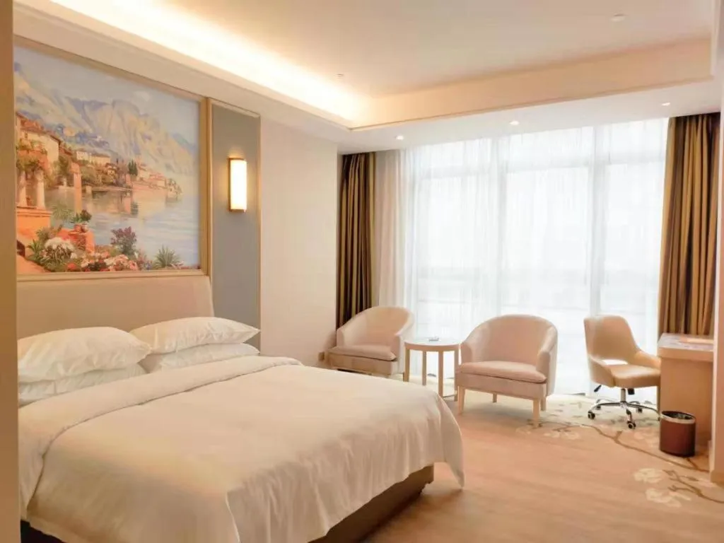 Bed in Vienna Hotel Fujian Fuqing Wanda Plaza